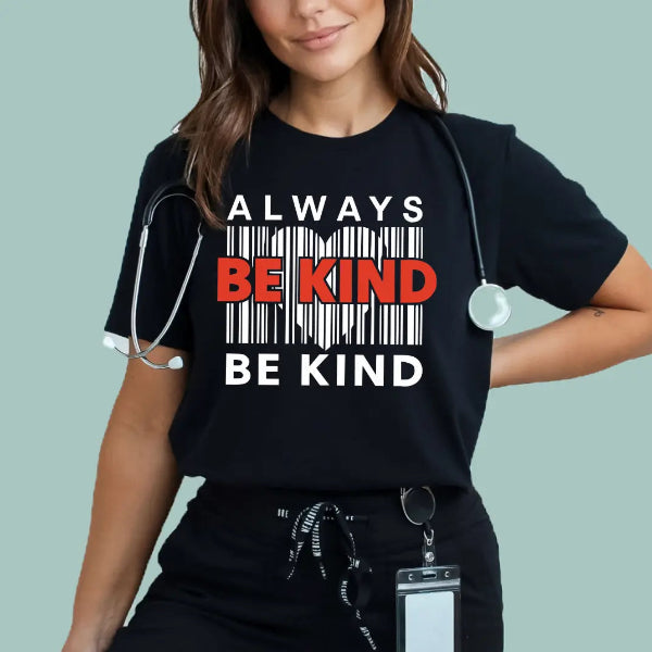 Person wearing a black t-shirt with 'Always Be Kind' message, stethoscope around neck, on light blue background