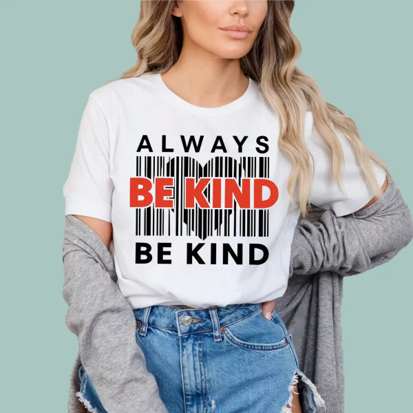 Person wearing a white t-shirt with 'Always Be Kind' text design on a light blue background
