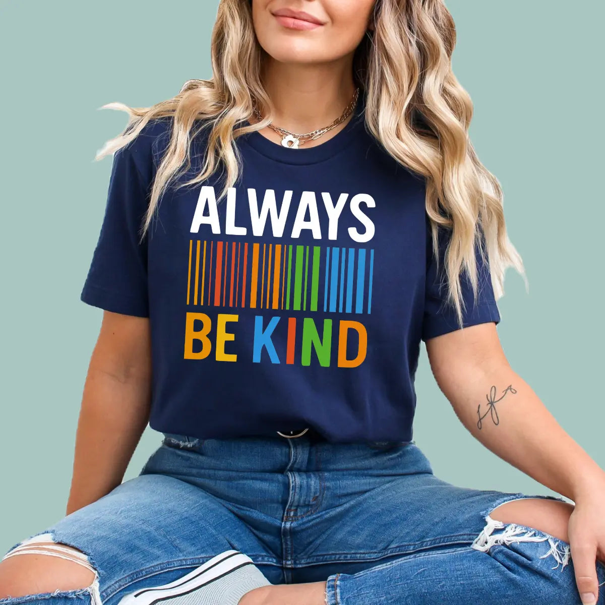 Navy blue "Always Be Kind" graphic tee featuring modern barcode-style typography.