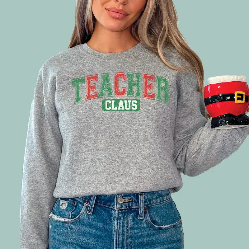 Grey Teacher Claus graphic sweatshirt, comfortable and festive wear for the holiday school season.