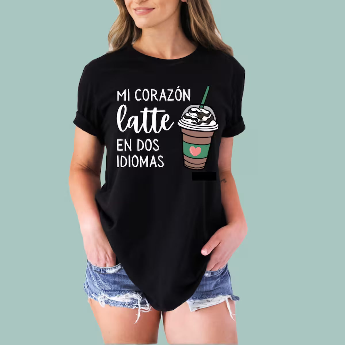 Black bilingual pride shirt for women, "Mi Corazón Late En Dos Idiomas" design by Alexander Crafts.