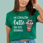 Kelly Green bilingual teacher shirt featuring "Mi Corazón Late En Dos Idiomas" text and a coffee heart graphic.