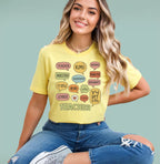 Woman wearing a yellow Multilingual Teacher Speech Bubble shirt featuring "Teacher" in different languages.