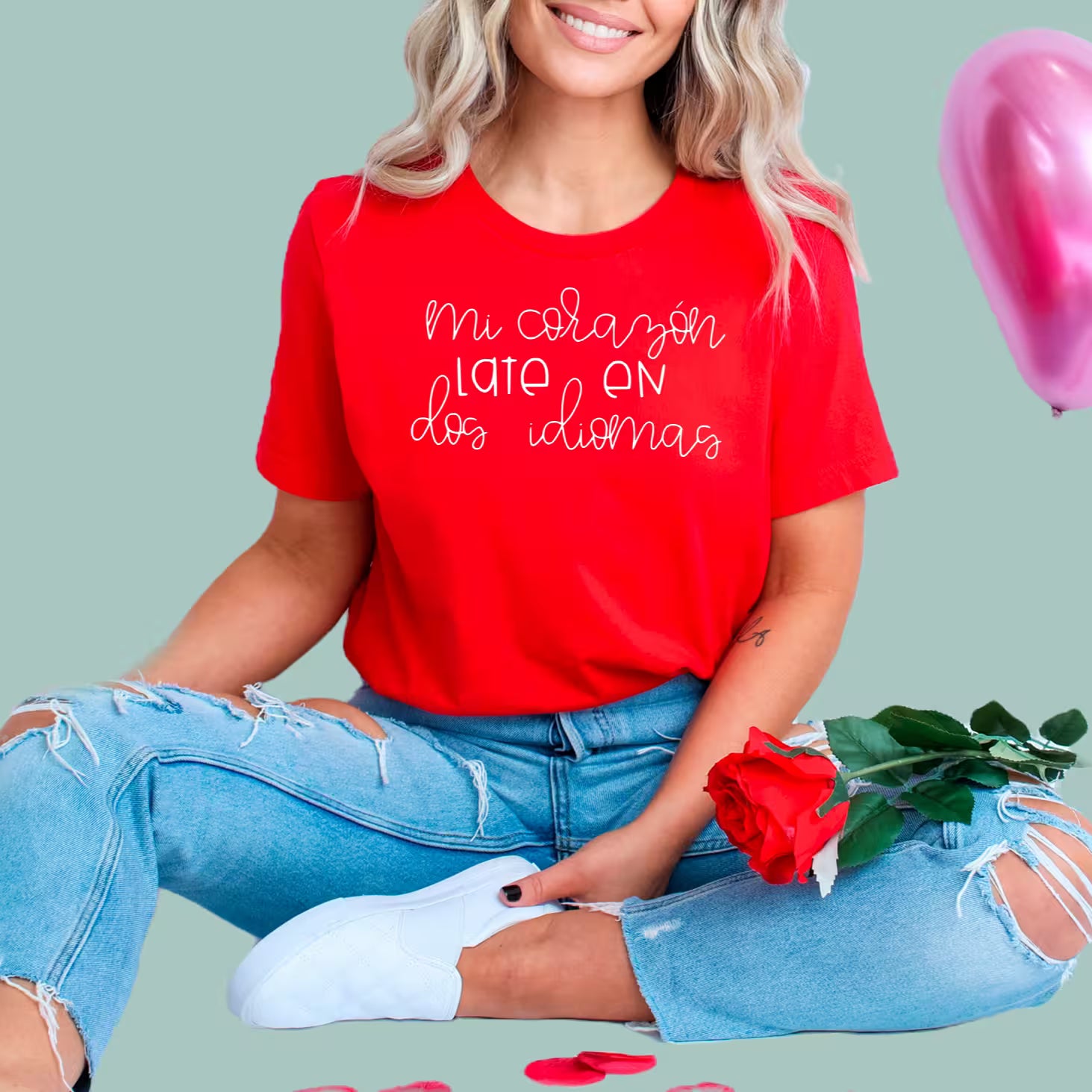Red bilingual teacher t-shirt featuring "Mi Corazón Late En Dos Idiomas" design with heart and pencil graphic.