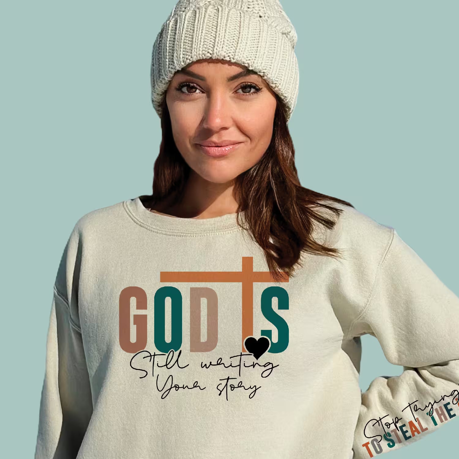 Tan-colored inspirational religious pullover featuring a minimalist design about trusting God's plan.