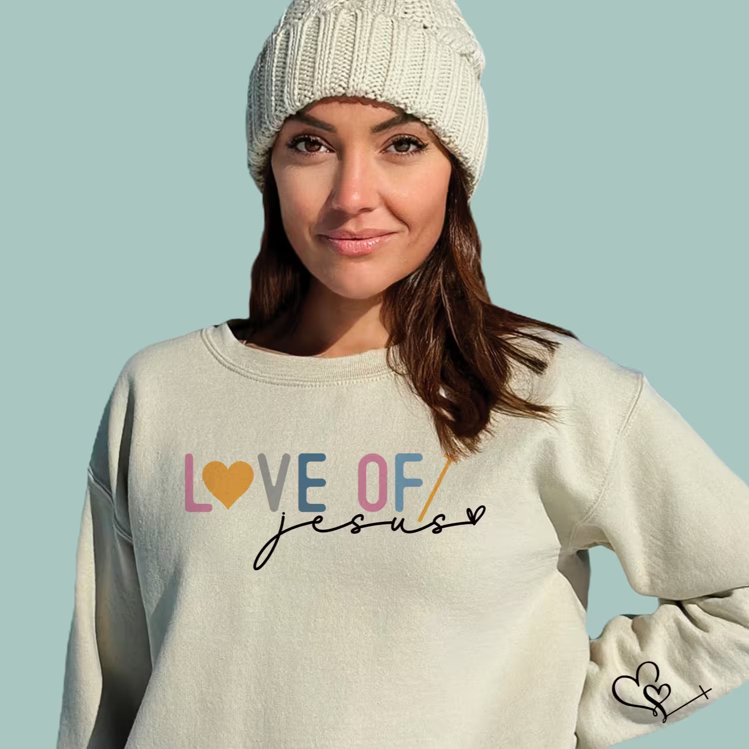 Tan-colored modern faith-based sweatshirt with "Love of Jesus" minimalist typography.
