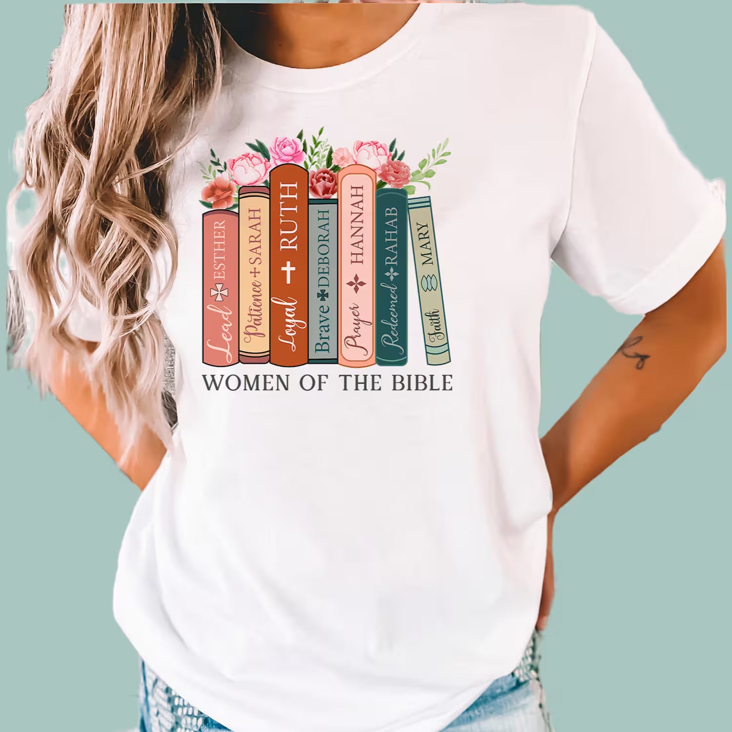 White graphic tee with a modern book-stack design honoring Deborah, Sarah, and Esther.