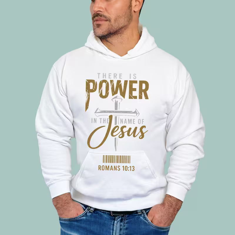 White Christian graphic unisex hoodie featuring "There Is Power in The Name of Jesus" distressed metallic design.
