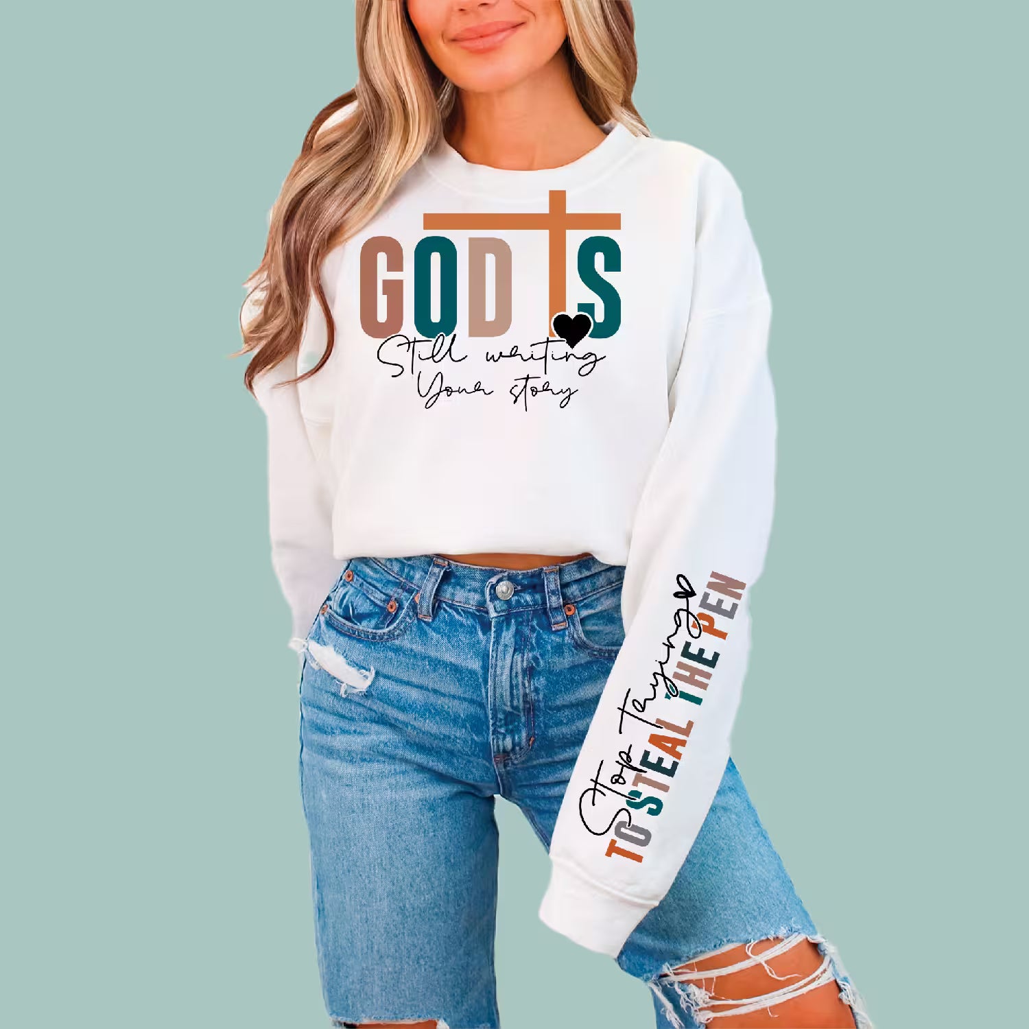 White "God Is Still Writing Your Story" sweatshirt, a perfect faith-based gift for friends and family.