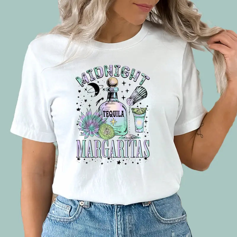 White boho summer party shirt with "Midnight Margaritas" graphic and desert moon accents.