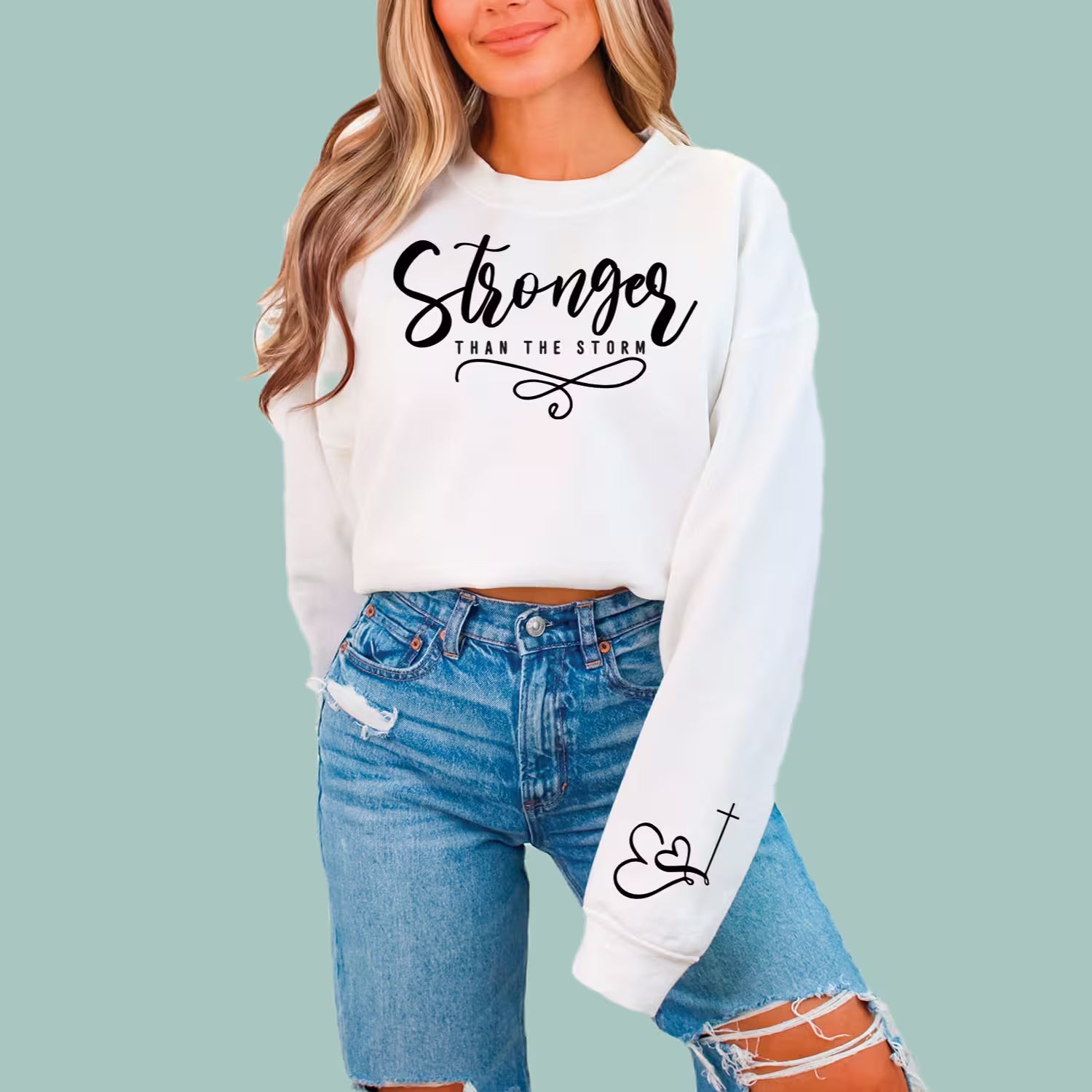 White "Stronger Than The Storm" faith-based pullover, comfortable streetwear for believers.