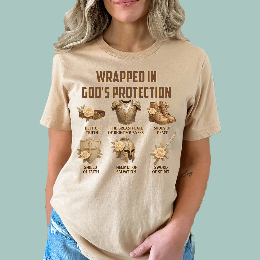 Tan-colored Christian tee featuring the 'Wrapped In God's Protection' Armor of God graphic.